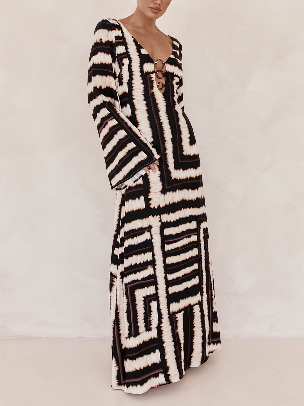 Chic Flattering V-Neck Maxi Dress with Unique Print and Ring-Tie Detail